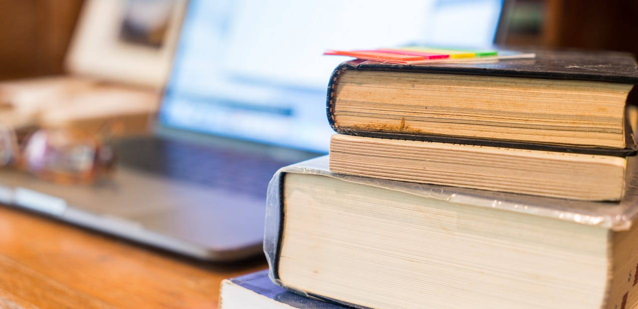 Studying desk with books and notebook